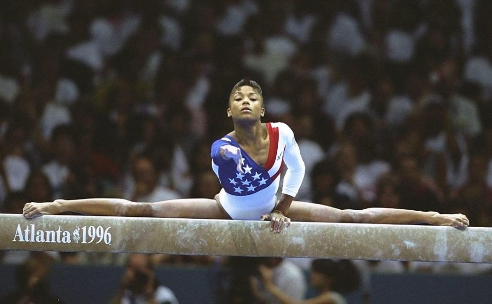 Dominique doing a full split on the balance beam