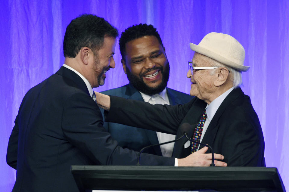 Honoree Norman Lear, right, is congratulated by presenters Jimmy Kimmel, left, and Anthony Anderson onstage at "The Paley Honors: A Special Tribute to Television's Comedy Legends" at the Beverly Wilshire Hotel, Thursday, Nov. 21, 2019, in Beverly Hills, Calif. (Photo by Chris Pizzello/Invision/AP)