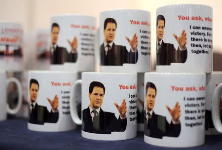 Mugs depicting Britain's Liberal Democrat party leader and Deputy Prime Minister Nick Clegg are seen on a stall ahead of the party's spring conference in Liverpool, Britain, in this March 13, 2015 file photo. REUTERS/Phil Noble/Files