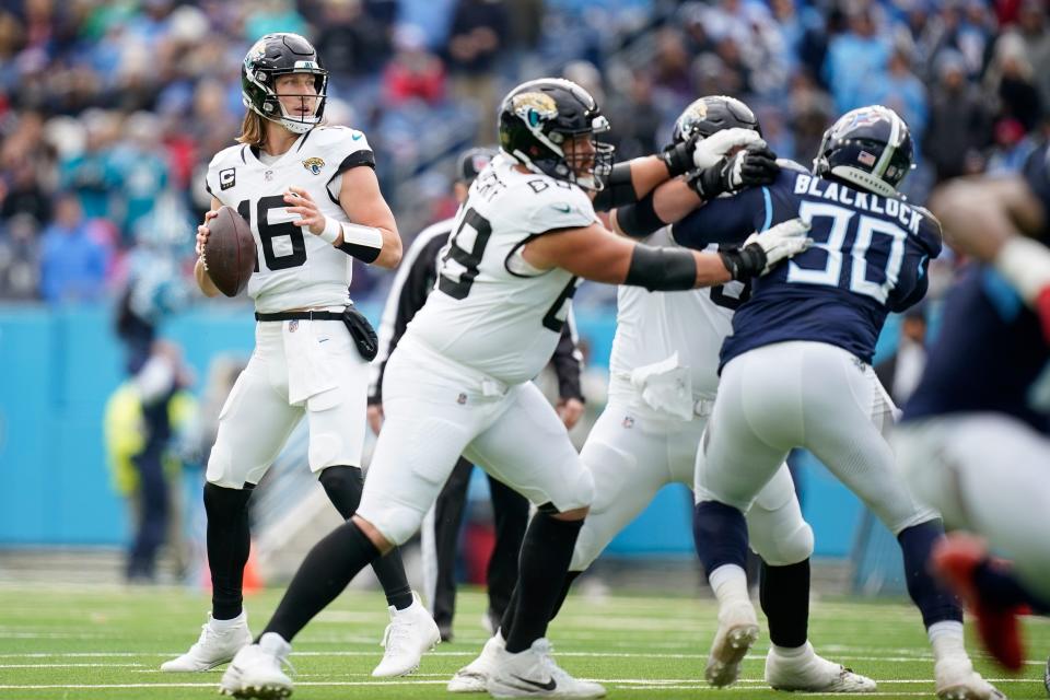 Jacksonville Jaguars quarterback Trevor Lawrence (16) looks for a receiver against the Tennessee Titans during the first quarter at Nissan Stadium in Nashville, Tenn., Sunday, Jan. 7, 2024.