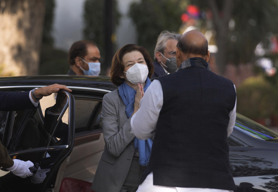 India's defense minister Rajnath Singh, right, greets his French counterpart Florence Parly upon her arrival for a joint military guard of honour in New Delhi, India, Friday, Dec. 17, 2021. (AP Photo/Manish Swarup)