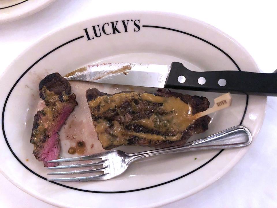 New York strip steak with peppercorn sauce at Lucky's