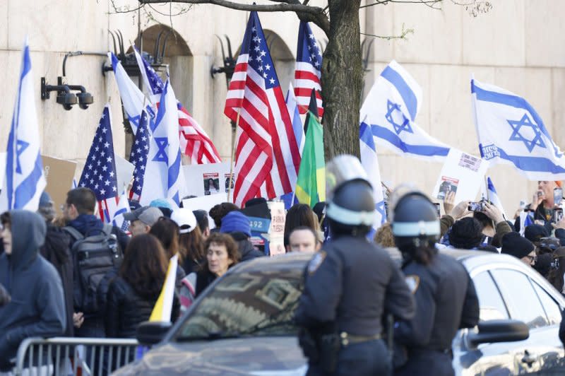 Pro-Israeli counter-protesters hold a rally outside of Columbia University in New York on Friday. The university announced that classes would be held remotely starting Monday, as pro-Palestinian protests have continued for almost two weeks on the school's campus. Photo by John Angelillo/UPI
