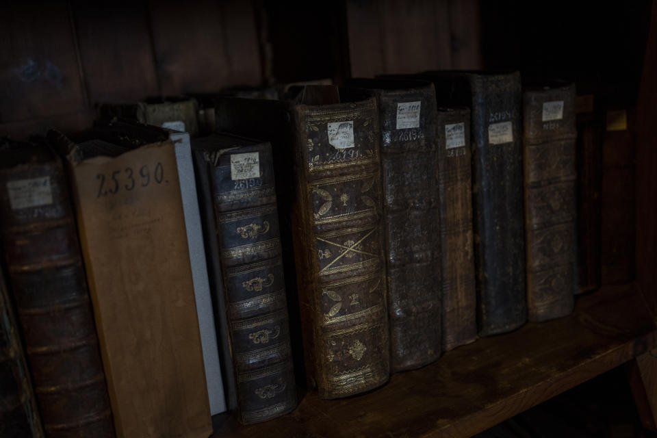 Old books rest on shelves at the Andrey Sheptytsky National Museum in the western Ukrainian city of Lviv, Friday, March 4, 2022. The doors of the museum have been closed since Russia’s war on Ukraine began on Feb. 24. (AP Photo/Bernat Armangue)