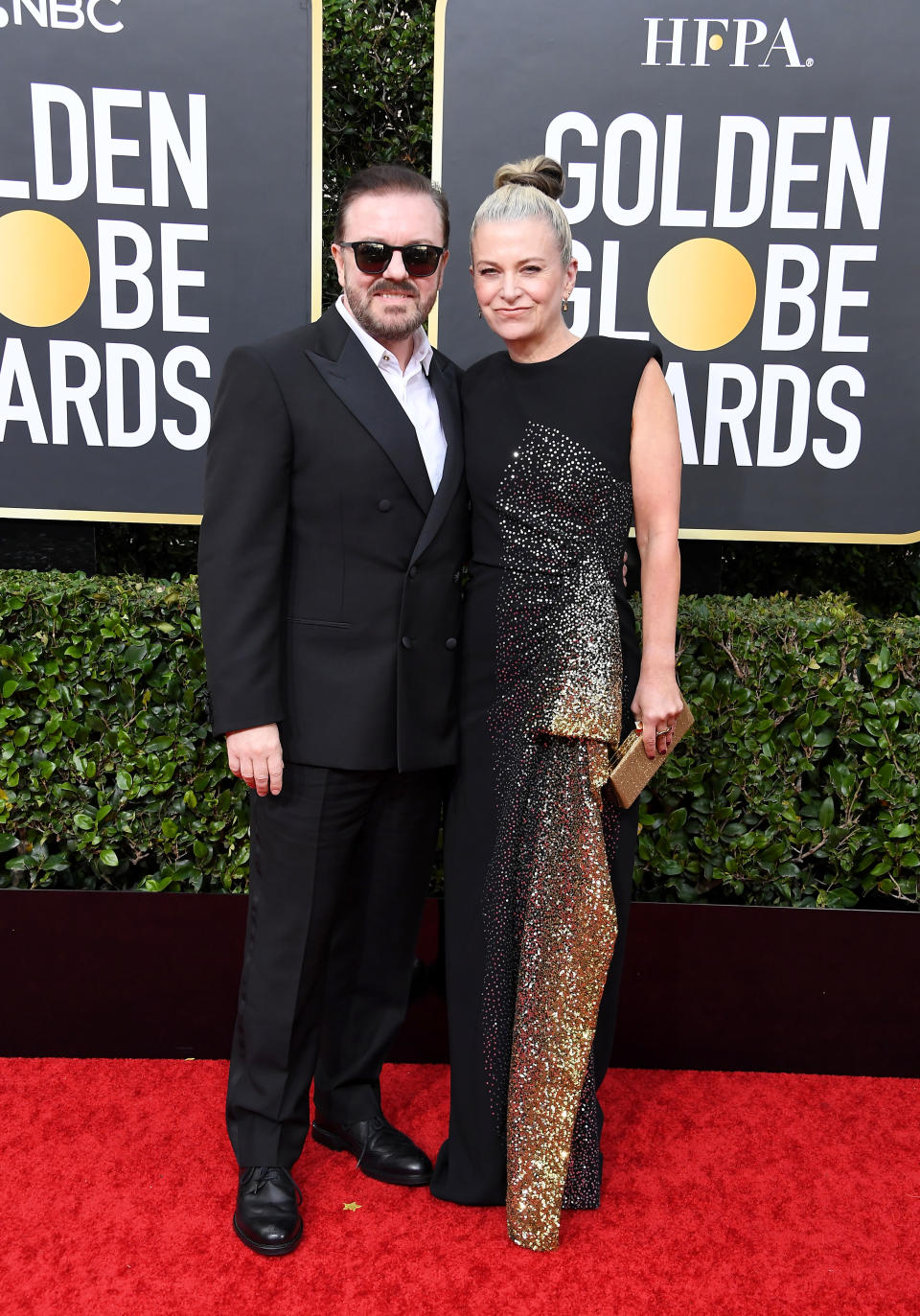 Ricky Gervais and Jane Fallon pose for photographers at the Golden Globes 