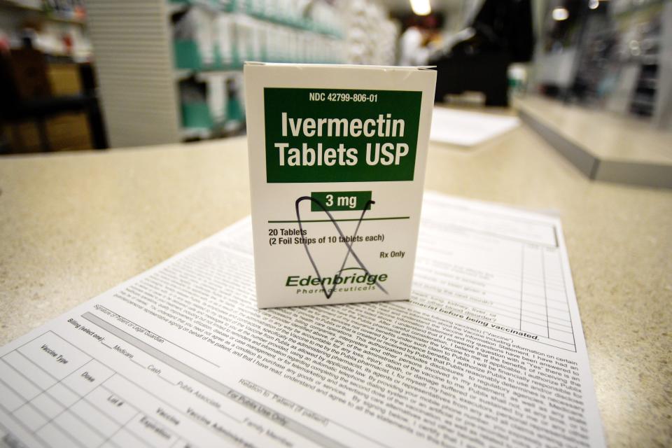 A box of ivermectin is shown in a pharmacy as pharmacists work in the background, Thursday, Sept. 9, 2021, in Ga.(AP Photo/Mike Stewart)