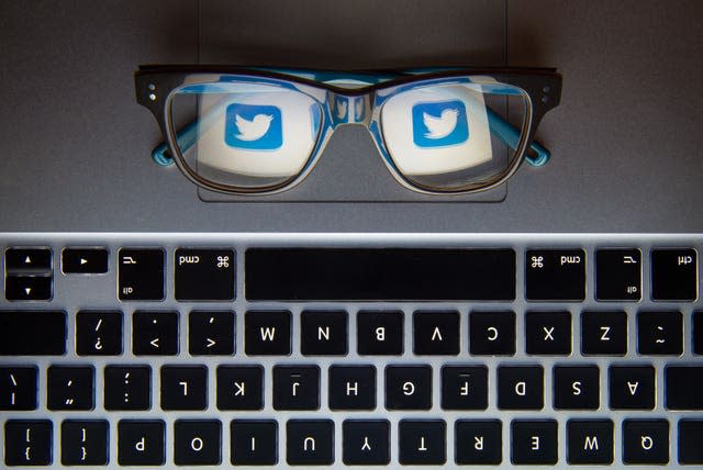 Twitter logo reflected in glasses