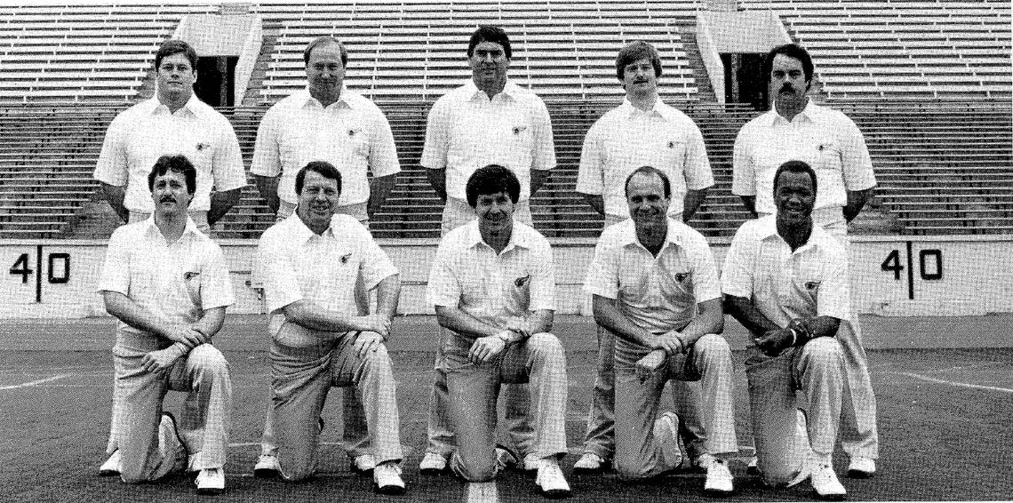 North Carolina head coach Mack Brown, centered in the front row, poses with his first coaching staff at Appalachian State in 1983.