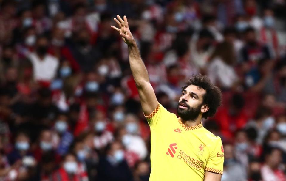 Mohamed Salah points to Liverpool fans and celebrates (Reuters)