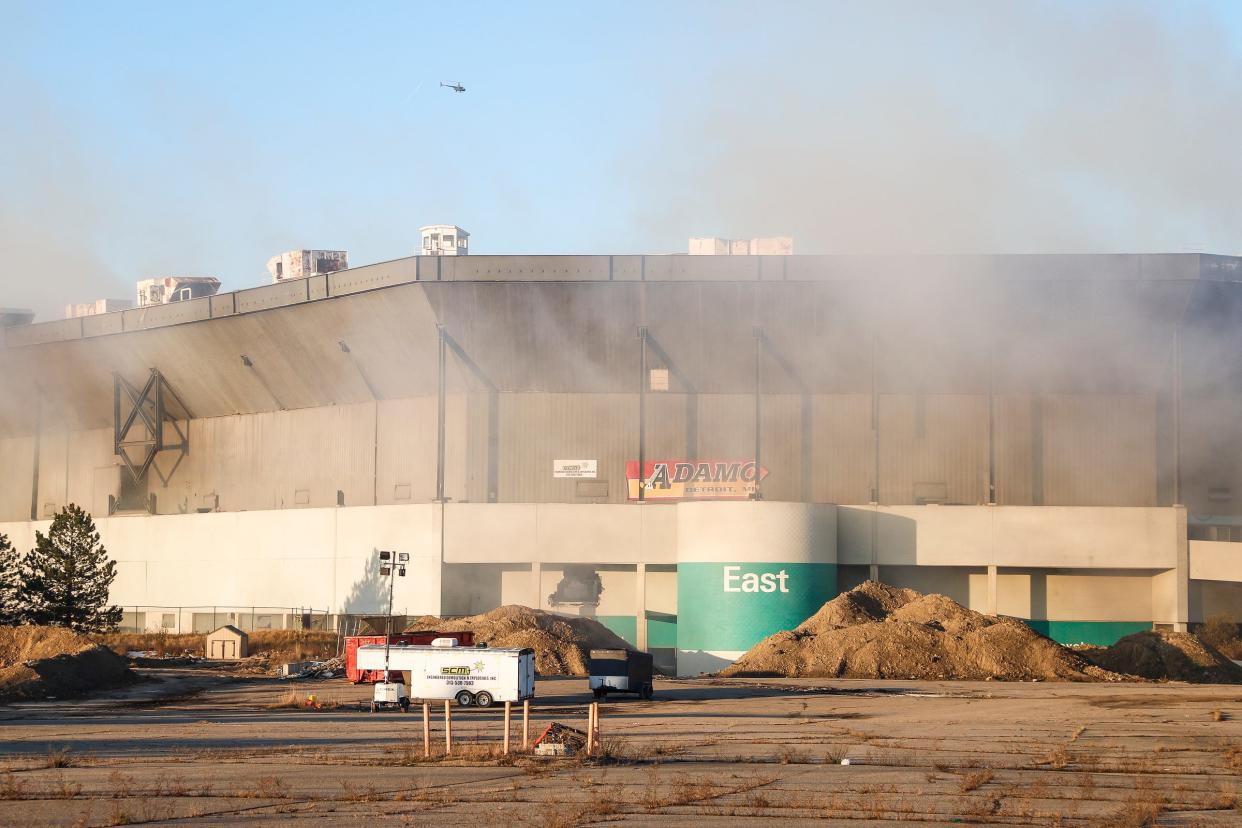 Smoke and dust come out of the Silverdome after its implosion in Pontiac on December 3, 2017.