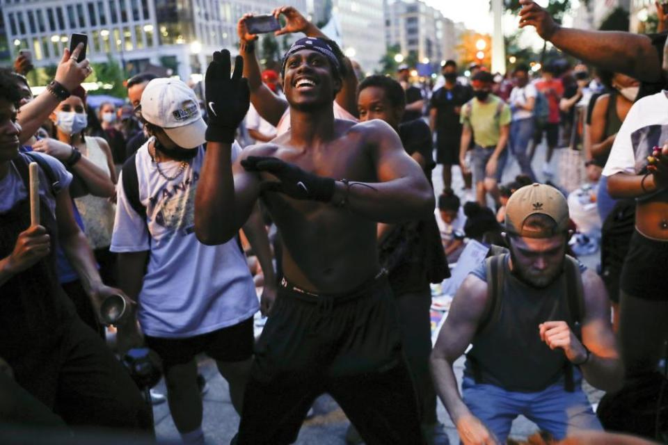 Samuel Brisbane, 19, of Baltimore, dances during a rally near the White House on Saturday.