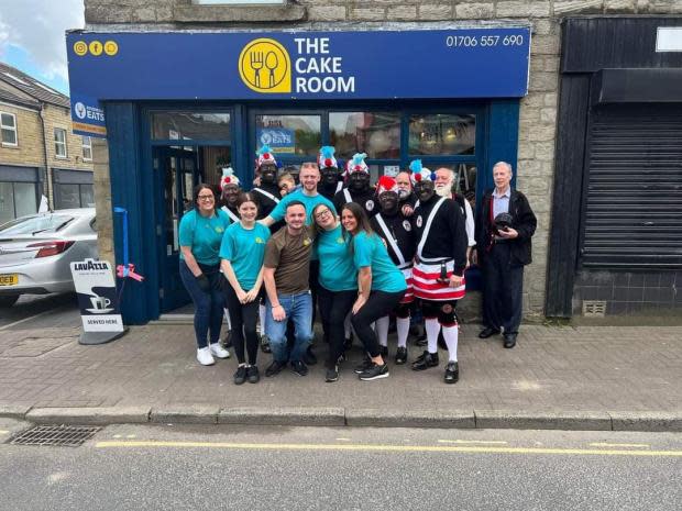 Lancashire Telegraph: The Cake Room team with the Britannia Coconut Dancers