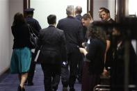 White House Chief of Staff Denis McDonough (C, with his glasses atop his head) departs after meeting with House Democrats about proposed U.S. military action against Syria, at the U.S. Capitol in Washington, September 10, 2013. REUTERS/Jonathan Ernst