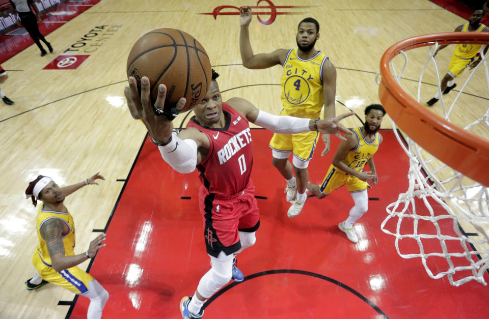 Houston Rockets' Russell Westbrook (0) goes up for a shot against the Golden State Warriors during the first half of an NBA basketball game Wednesday, Nov. 6, 2019, in Houston. (AP Photo/David J. Phillip)