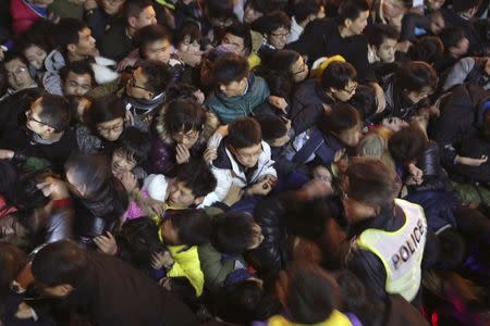 A view of a stampede is seen during the New Year's celebration on the Bund, a waterfront area in central Shanghai, December 31, 2014. REUTERS/Stringer