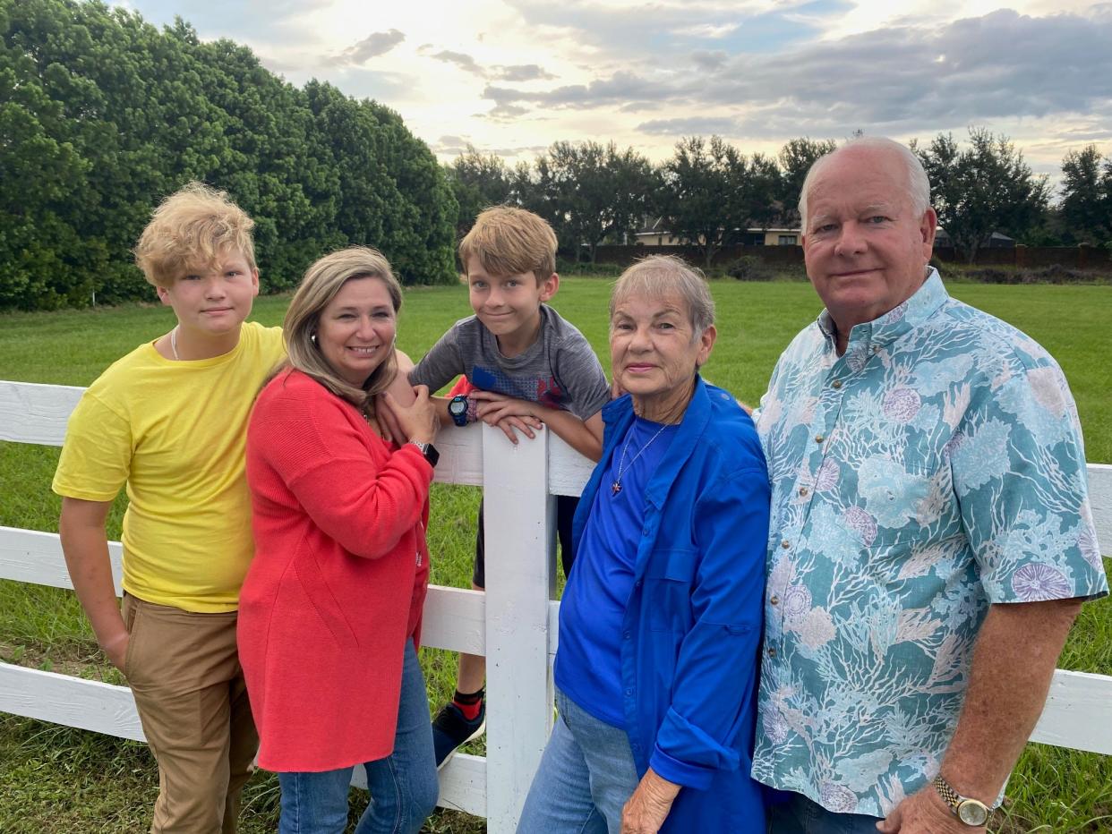 Gary Adams, far right, stands on his property in Manatee County with his wife, step-daughter and grandchildren. He has sued a local commercial real estate broker over a 40-acre transaction alleging negligence.