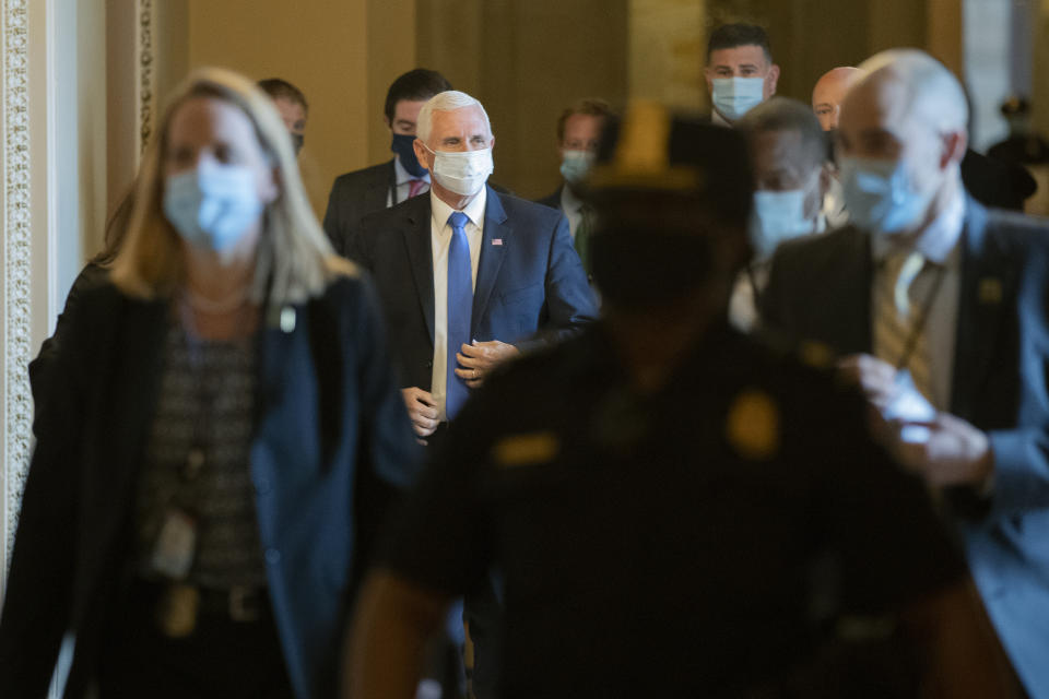 Vice President Mike Pence wears a face mask to protect against the spread of the new coronavirus as he departs a meeting with Senate Majority Leader Mitch McConnell of Ky., and Treasury Secretary Steve Mnuchin on Capitol Hill in Washington, Tuesday, May 19, 2020. (AP Photo/Patrick Semansky)