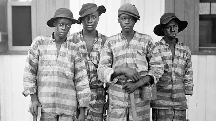 Men convicted of a crime and leased to harvest timber in Florida, photographed in 1915. (Photo: Library of Congress via AP)