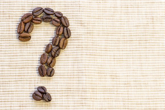 A question mark composed of coffee beans