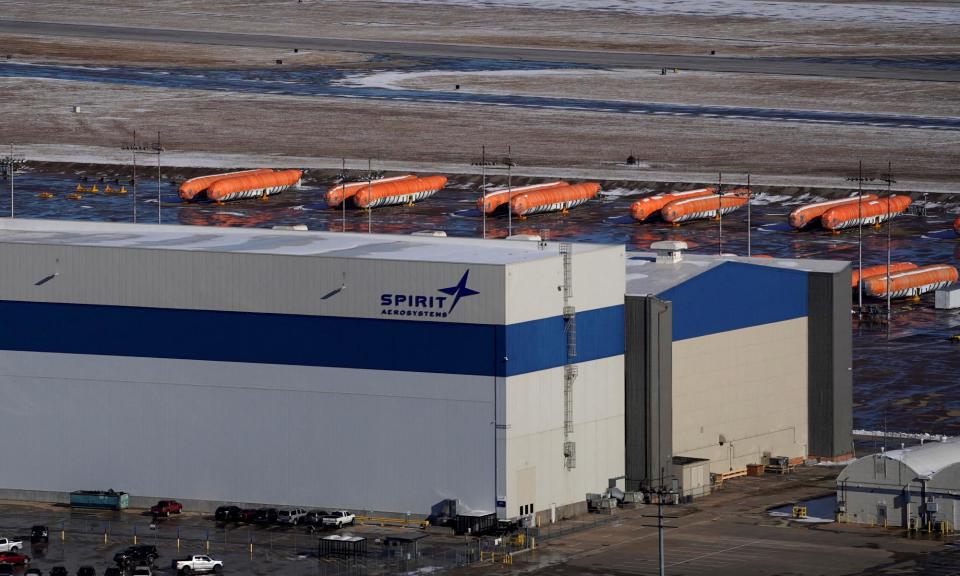 <span>Airplane fuselages bound for Boeing's 737 Max production facility sit in storage behind Spirit AeroSystems headquarters, in Wichita, Kansas, in 2019.</span><span>Photograph: Nick Oxford/Reuters</span>