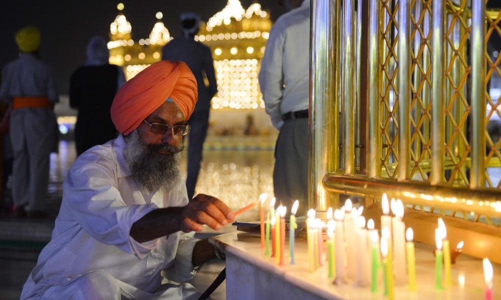 Sikh devotees gather during the Diwali festival at the illuminated Golden Temple in Amritsar, India, on 18 October 2017