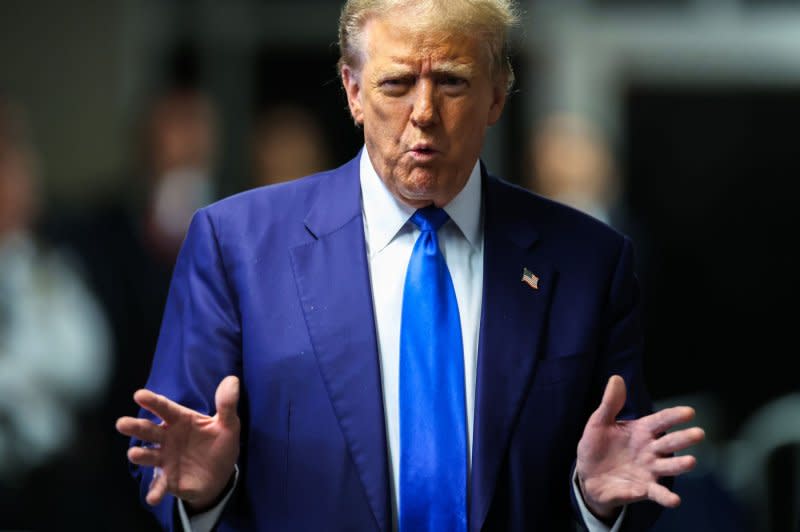 Former President Donald Trump arrives for his criminal trial at Manhattan criminal court in New York on Friday. Trump's trial is wrapping up the third week on charges he allegedly falsified business records to cover up a sex scandal during the 2016 presidential campaign. Pool Photo by Charly Triballeau//UPI