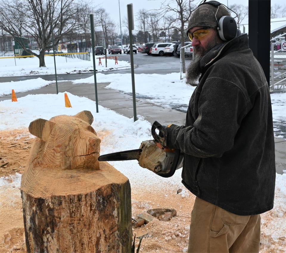 Scott Lepley of Fremont, Indiana carved this log into a bear for those at Winterfest.