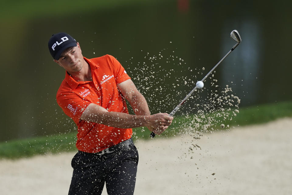 Viktor Hovland, of Norway, hits from the sand on the 11th green during the first round of play in The Players Champiuonship golf tournament Thursday, March 10, 2022, in Ponte Vedra Beach, Fla. (AP Photo/Gerald Herbert)