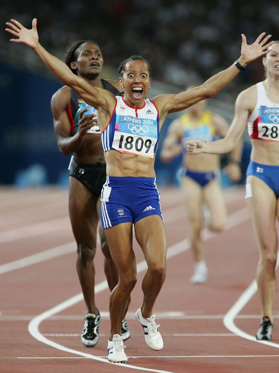 ATHENS - AUGUST 23: Kelly Holmes of Great Britain celebrates after she won gold in the women's 800 metre final on August 23, 2004 during the Athens 2004 Summer Olympic Games at the Olympic Stadium in the Sports Complex in Athens, Greece. (Photo by Stu Forster/Getty Images)