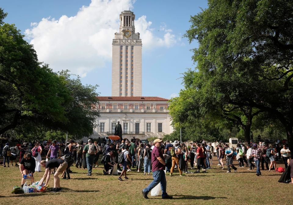 Protesters pick up litter on the UT South Mall after the April 29 demonstration. An analysis by the American-Statesman of those arrested in last month's protests found that nearly 65% of them had the same name as a student or an alumnus in UT’s directory.
