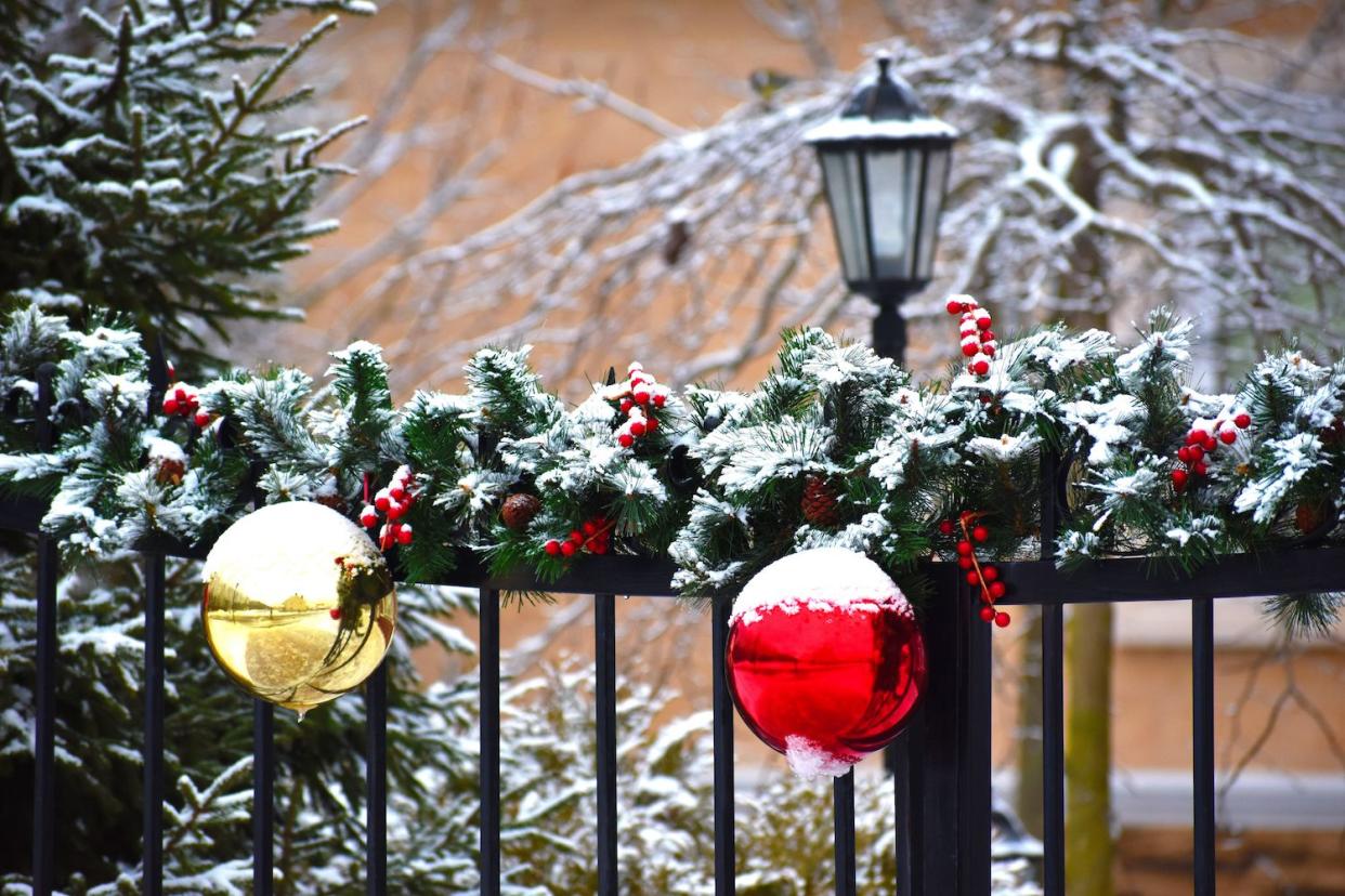 holiday garland on fence and gate