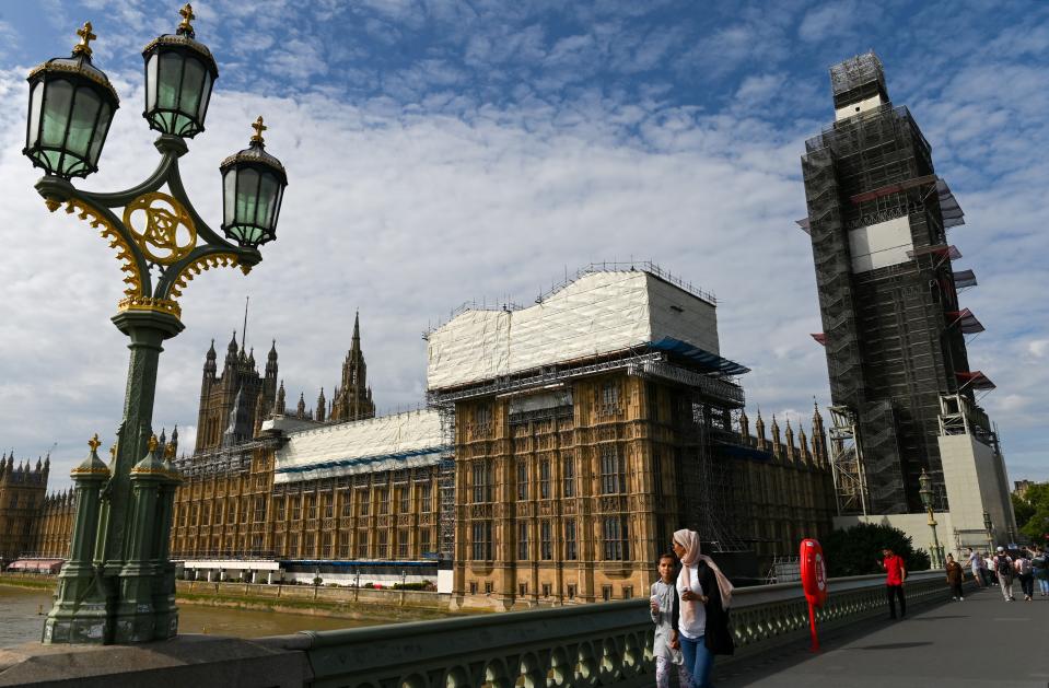 Pedestrians walk past the Palace of Westminster, housing the Houses of Parliament, pictured from Westminster Bridge, in central London on August 28, 2019. - British Prime Minister Boris Johnson announced Wednesday that the suspension of parliament would be extended until October 14 -- just two weeks before the UK is set to leave the EU -- enraging anti-Brexit MPs. (Photo by DANIEL LEAL-OLIVAS / AFP)        (Photo credit should read DANIEL LEAL-OLIVAS/AFP/Getty Images)