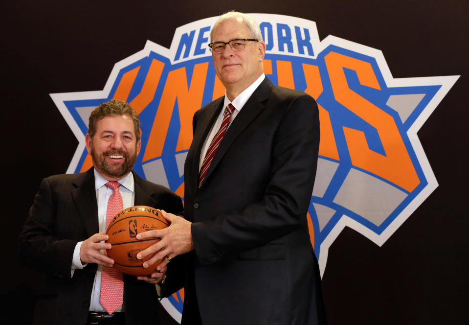 New York Knicks owner James Dolan, left, and new team president Phil Jackson poses for photos during a news conference where he was introduced, at New York's Madison Square Garden, Tuesday, March 18, 2014. (AP Photo/Richard Drew)