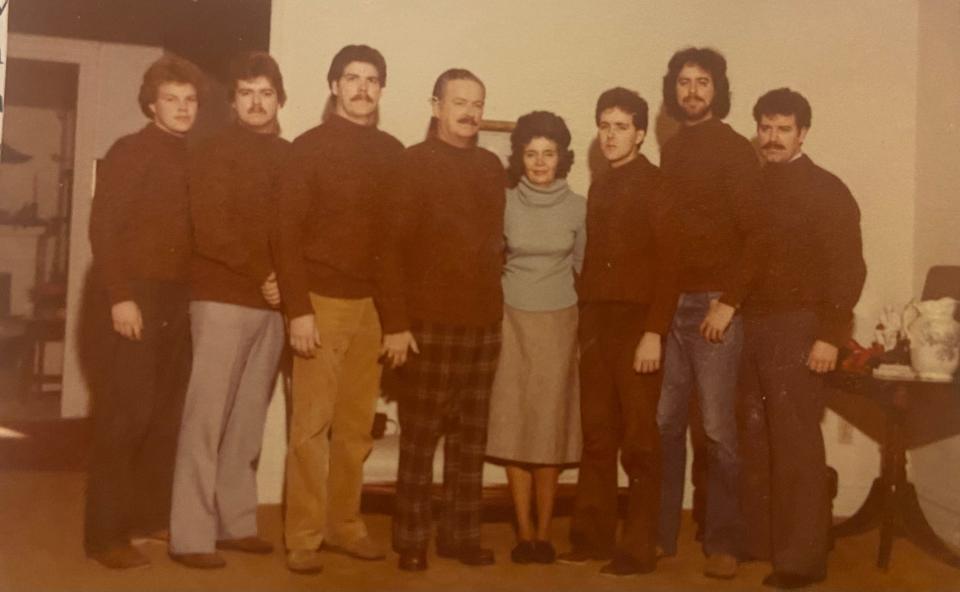 In the late 1980s or early 1990s, Maj. Gen. Michael Healy, in center with wife Jacklyn, bought matching sweaters at Christmas for his sons, from left, Pat, Kirk, Sean, Tim, Mike and Dan.