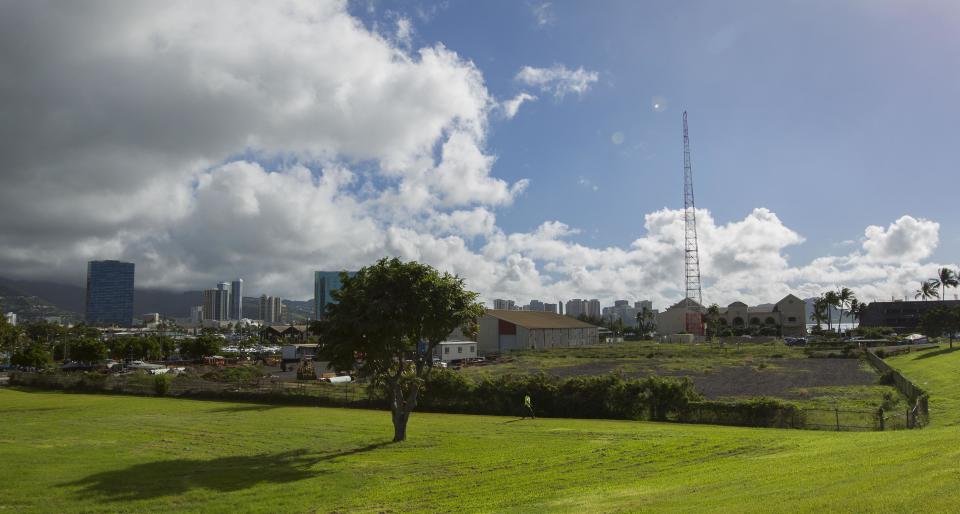 FILE - This Dec. 24, 2013 file photo shows one possible location in the Kakaako district of Honolulu to be considered for the Barack Obama Presidential Library. The location is considered prime real estate with views of the ocean and Koolau mountains. Casting an eye beyond his presidency, President Barack Obama is giving his blessing to a new foundation that will plan his presidential library and build a lasting monument to his legacy. (AP Photo/Eugene Tanner)