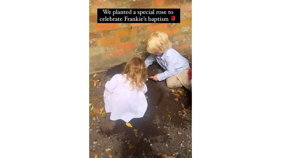 Wilf and Romy Johnson planting a rose for brother Frank