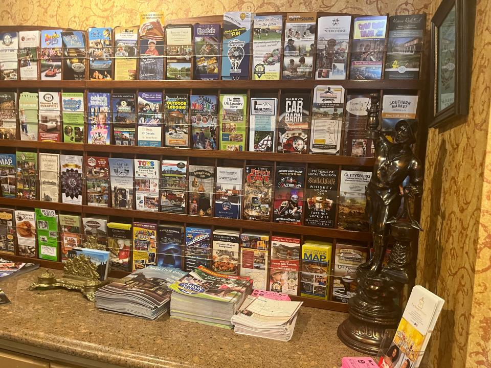 wall of brochures at the fulton steamboat inn