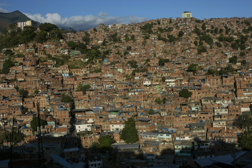 Cinderblock homes cover a hill in the Jose Felix Ribas neighborhood of the Petare slum in Caracas, Venezuela, Sunday, Feb. 10, 2019. Last year, inflation in the South American country hit 1 million percent. (AP Photo/Rodrigo Abd)