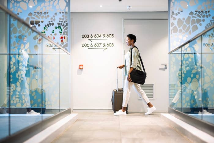 woman walking into an upscale hotel