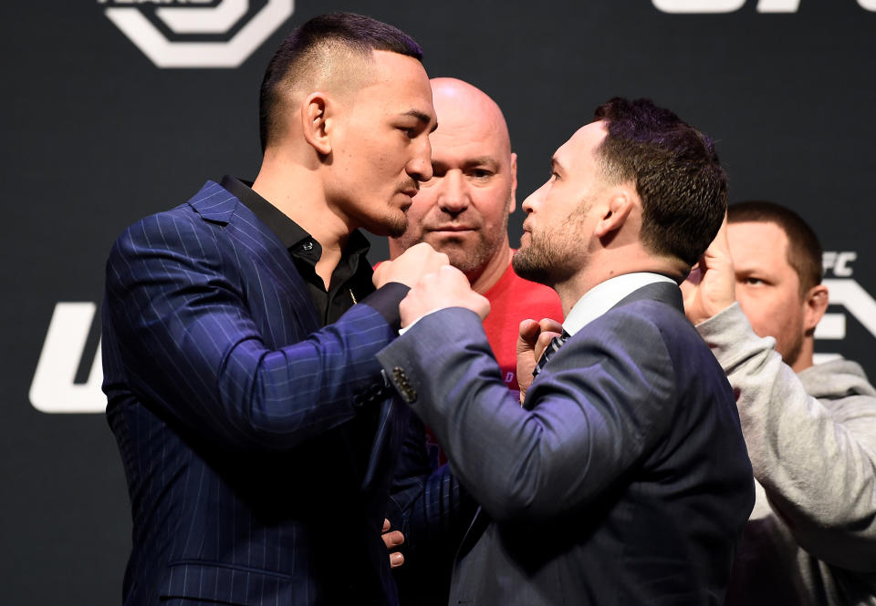 Featherweight champion Max Holloway (L) will defend his title against ex-lightweight champion Frankie Edgar on March 3 at UFC 222 at T-Mobile Arena in Las Vegas. Edgar is looking to become only the fifth UFC fighter to hold a title in two weight classes. (Getty Images)