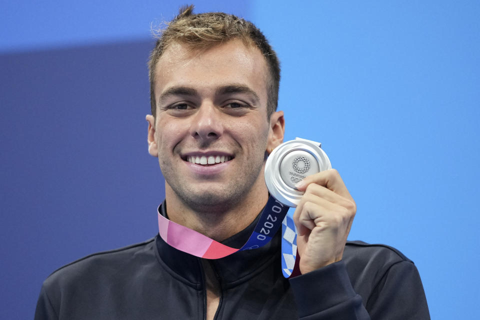 Gregorio Paltrinieri of Italy poses with his silver medal for the men's 800-meters freestyle final at the 2020 Summer Olympics, Thursday, July 29, 2021, in Tokyo, Japan. (AP Photo/Matthias Schrader)