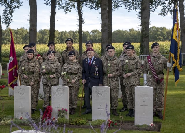 Veteran lays wreath at grave