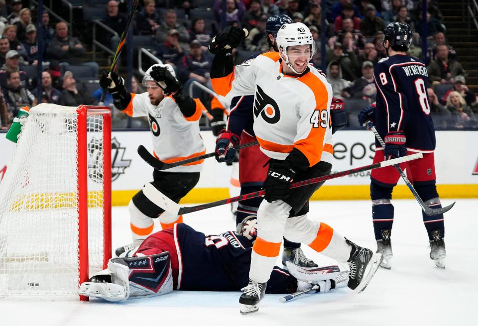 Philadelphia Flyers left wing Noah Cates (49) scores a goal against Columbus Blue Jackets goaltender Elvis Merzlikins (90) during the 2nd period of their NHL game at Nationwide Arena in Columbus, Ohio on April 7, 2022.  