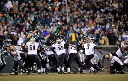 Jan 4, 2014; Philadelphia, PA, USA; New Orleans Saints kicker Shayne Graham (3) kicks the game-winning field goal against the Philadelphia Eagles during the fourth quarter of the 2013 NFC wild card playoff football game at Lincoln Financial Field. Mandatory Credit: Joe Camporeale-USA TODAY Sports