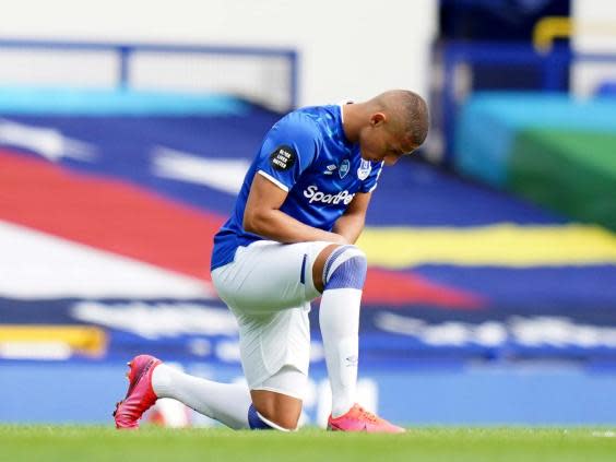 Richarlison takes a knee in support of the Black Lives Matter movement (2020 Pool)