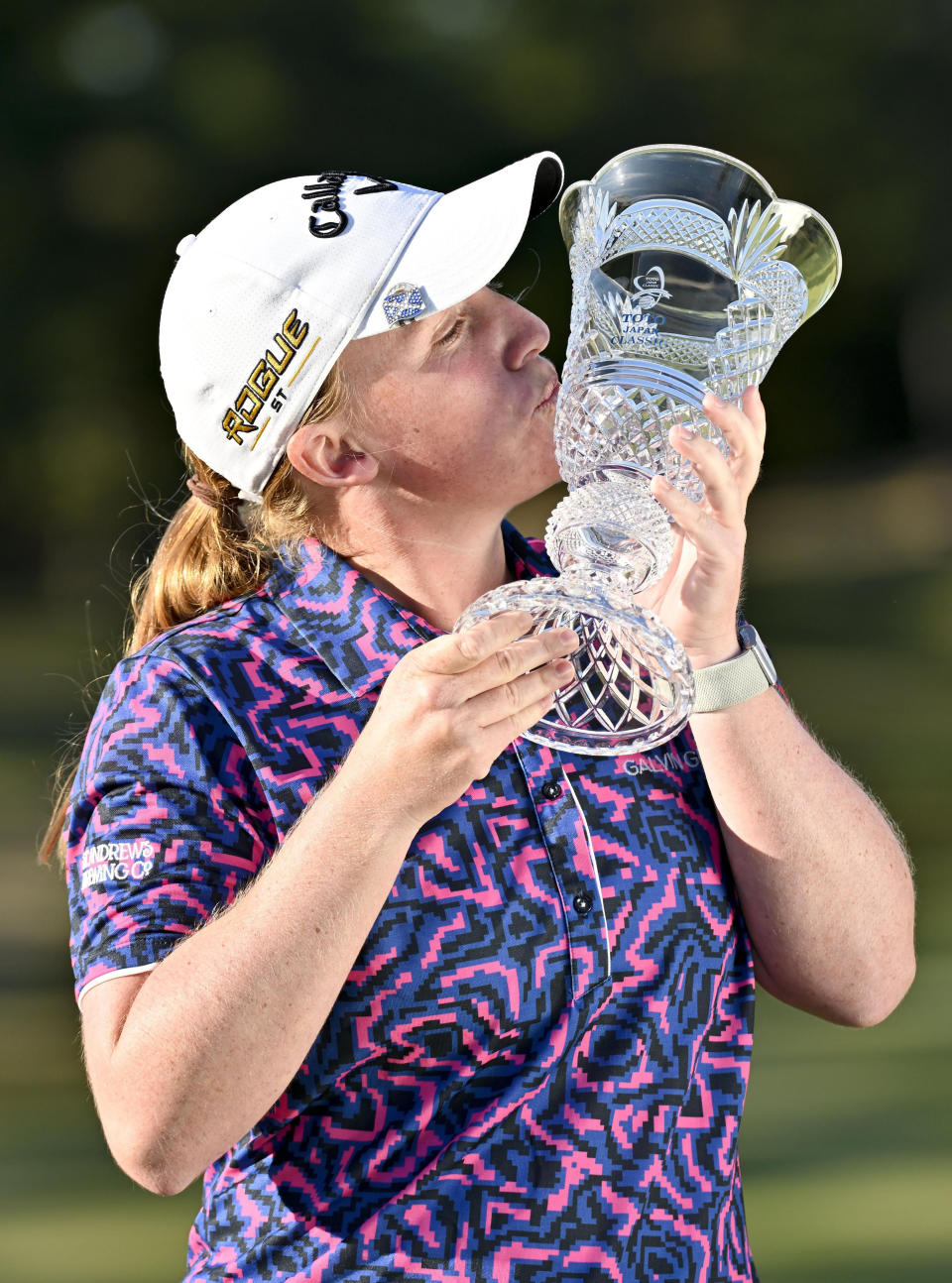 Gemma Dryburgh of Scotland kisses the trophy after winning the LPGA Tour's Toto Japan Classic at the Seta Golf Club in Shiga, Japan, Sunday, Nov. 6, 2022. (Kyodo News via AP)