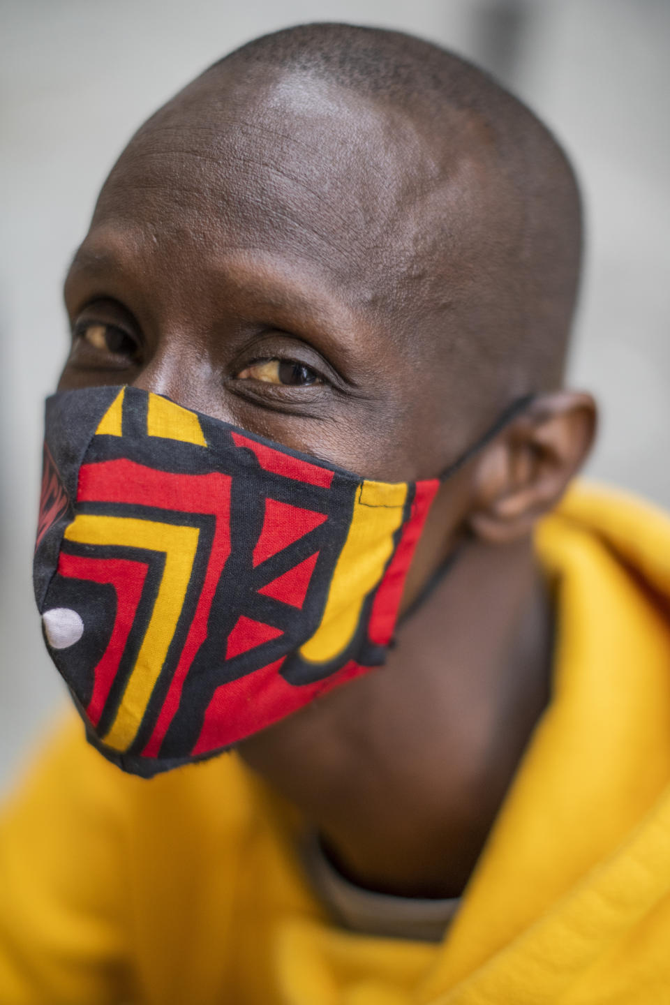 Serigne Mbaye, who is running on a ticket with the anti-austerity United We Can party in the Madrid regional assembly elections, poses for a portrait in Madrid, Spain, Tuesday, April 13, 2021. Mbaye, a Senegalese-born environmental refugee wants to defy a history of underrepresentation of the Black community and other people of color in Spanish politics. Serigne Mbaye's candidacy has been met with a racist response from an increasingly influential far-right political party. (AP Photo/Bernat Armangue)