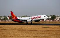 FILE PHOTO: A SpiceJet Boeing 737 passenger aircraft takes off from Sardar Vallabhbhai Patel international airport in Ahmedabad