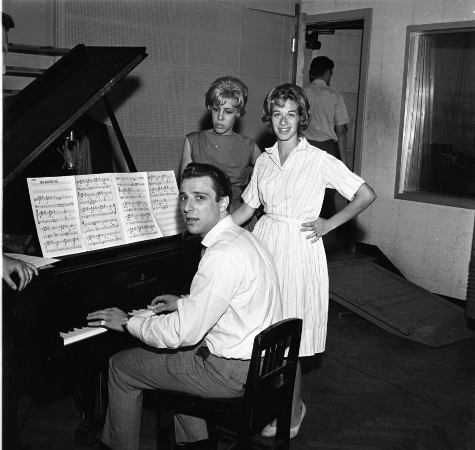 Barry Mann, Cynthia Weil (standing left) and Carole King at work in 1959 in New York (Getty Images)