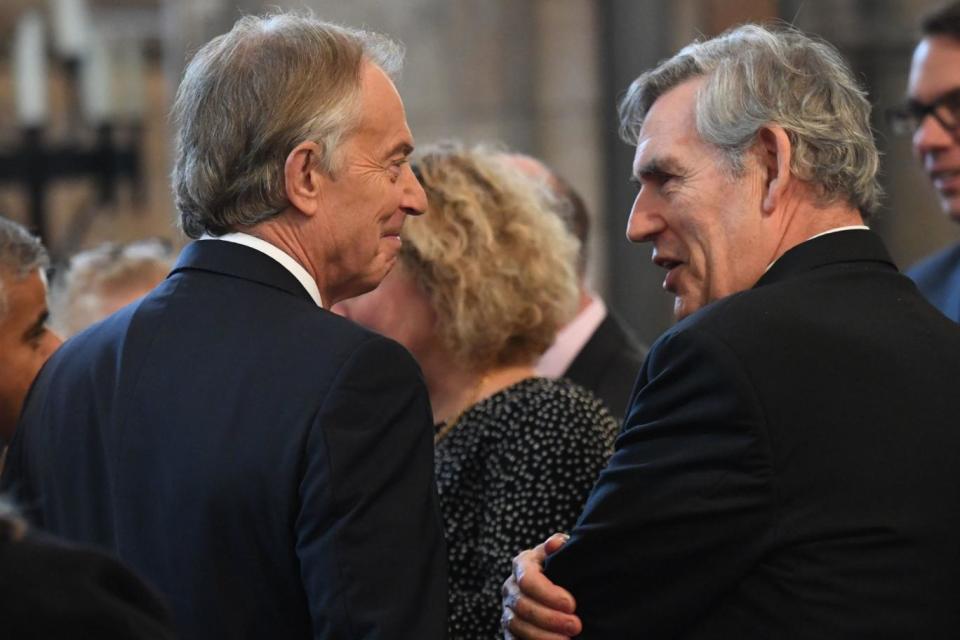 Tony Blair and Gordon Brown chat at the service (PA)
